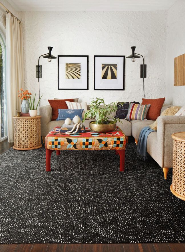Living room featuring FLOR area rug Hemline shown in Flint